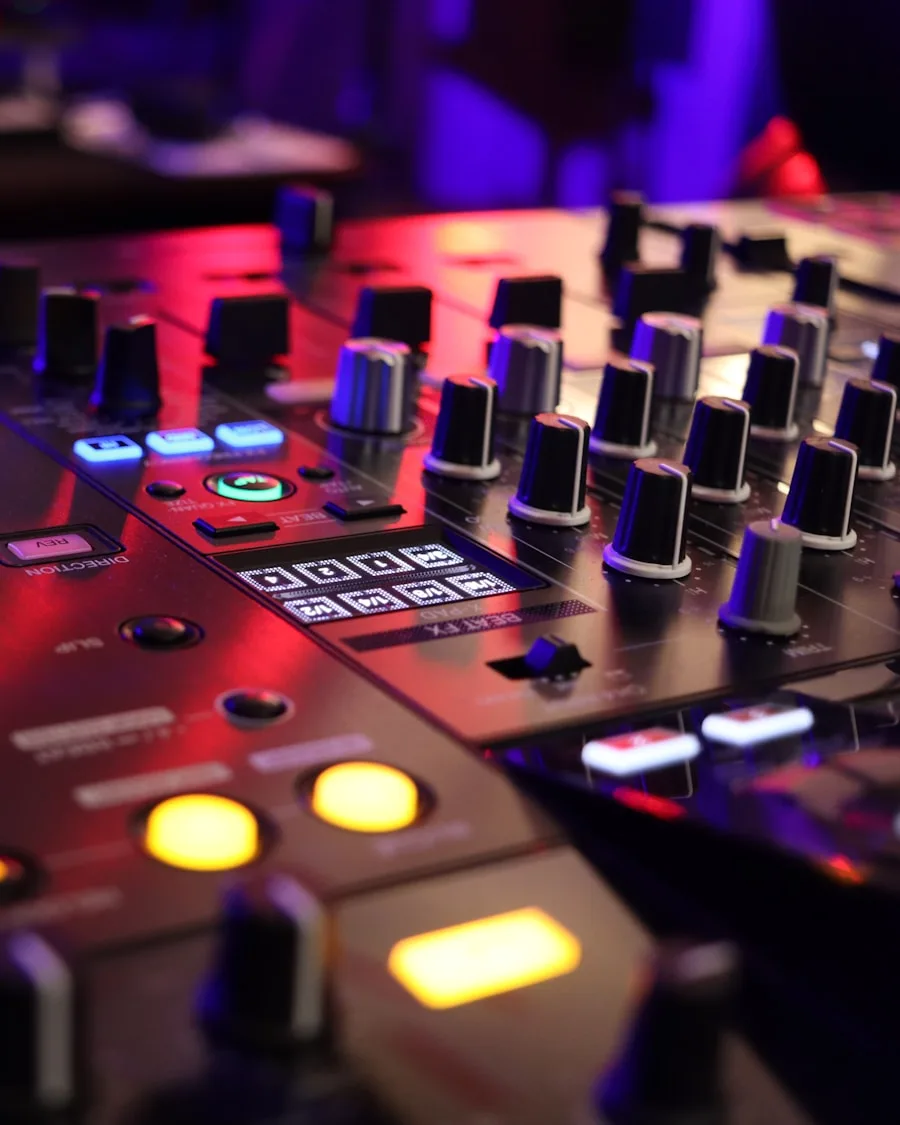 A DJ mixer's knobs and pads lit up mid-set